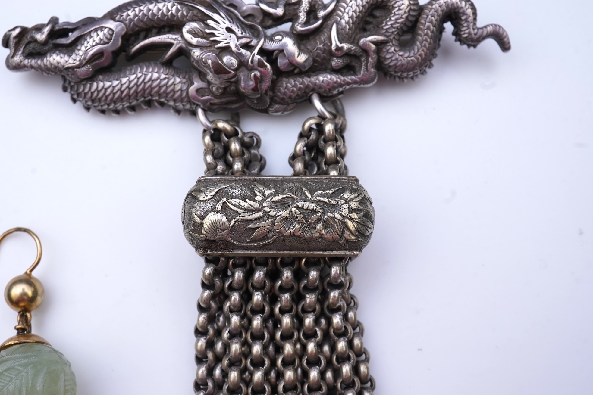 A chatelaine and a pair of serpentine bead earrings